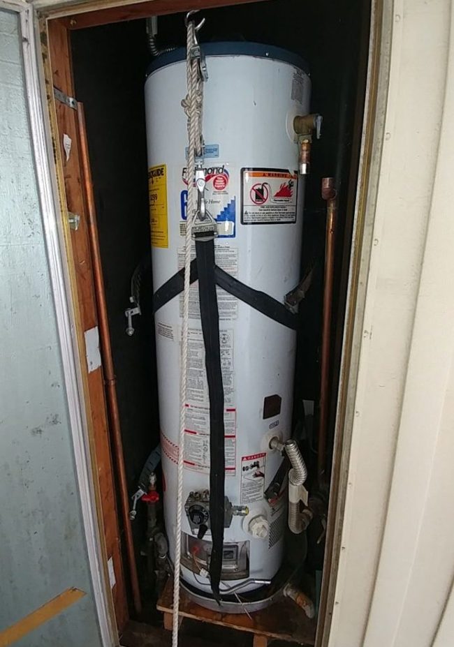 Lifting the Water Heater into a raised cabinet